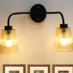 Florence Ribbed Glass dual-light wall sconce with textured ribbed glass shades and a matte black metal frame, perfect for modern bedrooms, hallways, living rooms, and dining spaces.