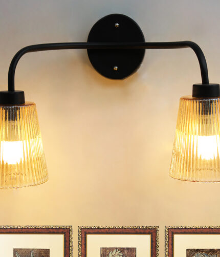 Florence Ribbed Glass dual-light wall sconce with textured ribbed glass shades and a matte black metal frame, perfect for modern bedrooms, hallways, living rooms, and dining spaces.