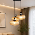Amber Ribbed Glass cluster hanging light with four textured glass pendant shades, black metal fittings, and layered design for modern interior lighting.