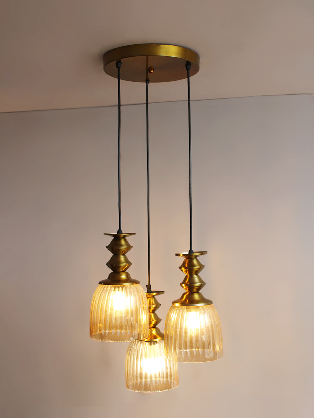 Ribbed Glass 3-Light Cluster Hanging Lamp Ribbed Glass 3-Light adjustable pendant ceiling light with three textured glass shades, golden metal accents, black adjustable cords, 9-inch canopy, and elegant modern hanging design.