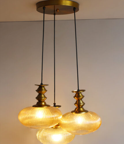 Ribbed Amber Kachori Glass 3-light adjustable pendant ceiling light with three rounded textured amber ribbed glass shades, elegant golden metal holders, 9-inch ceiling canopy, and 23-inch adjustable hanging cords.