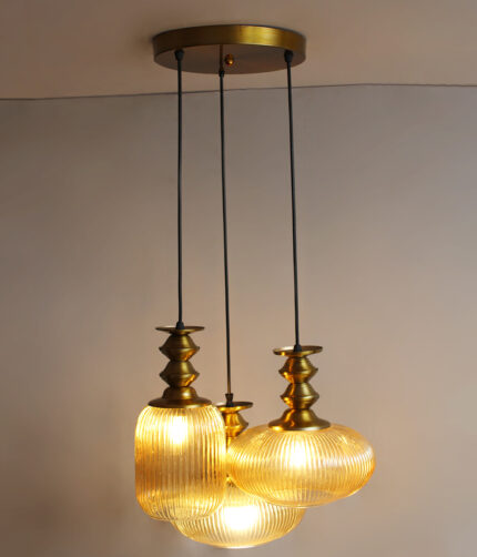 Ribbed Modern Ribbed Glass 3-light adjustable pendant ceiling light featuring three textured ribbed glass shades in different shapes, elegant golden metal holders, black hanging cords, 9-inch canopy, and up to 23-inch adjustable height.