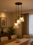 Modern Triple Glass cluster hanging light with three clear ribbed glass shades and black metal ceiling mount.