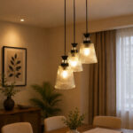 Modern Triple Glass cluster hanging light with three clear ribbed glass shades and black metal ceiling mount.