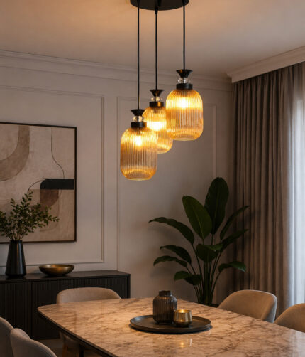 Decorative 3-Light cluster hanging light with three amber ribbed glass shades and black adjustable ceiling mount.