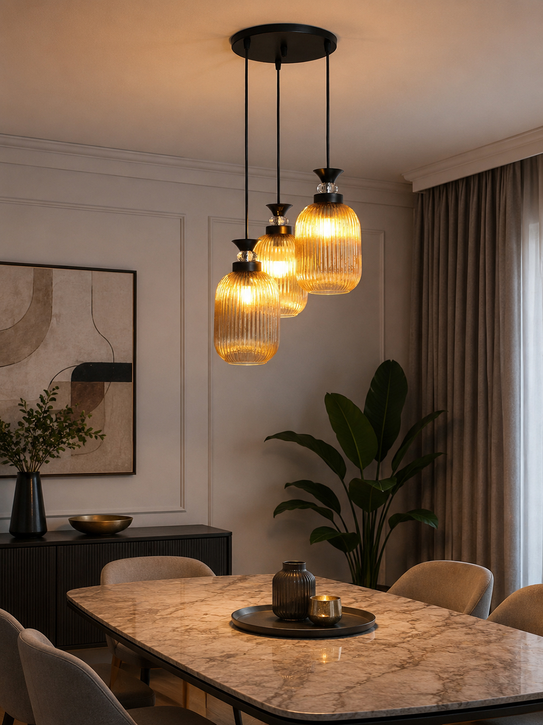Decorative 3-Light Cluster Hanging Light Decorative 3-Light cluster hanging light with three amber ribbed glass shades and black adjustable ceiling mount.