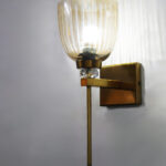 Brass finish wall light with ribbed glass shade, crystal accent and rectangular wall plate shown with product dimensions.