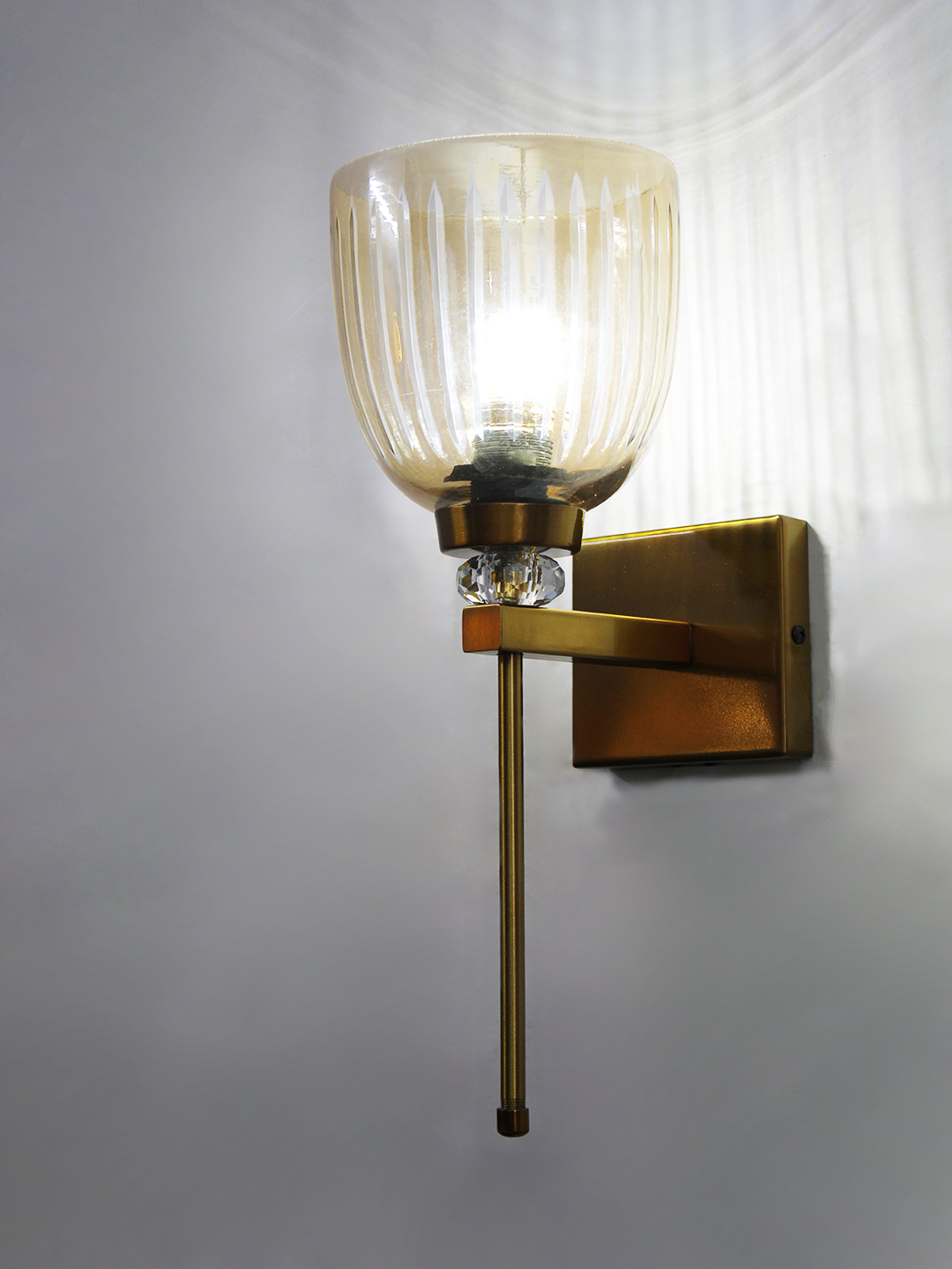 Brass Finish Ribbed Glass Wall Sconce Brass finish wall light with ribbed glass shade, crystal accent and rectangular wall plate shown with product dimensions.