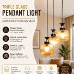 Clear Ribbed Glass cluster hanging light with three pendant shades, black metal fittings, and adjustable drops for modern dining room and living room interiors.