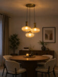 Ribbed Amber Kachori Glass 3-light adjustable pendant ceiling light with three rounded textured amber ribbed glass shades, elegant golden metal holders, 9-inch ceiling canopy, and 23-inch adjustable hanging cords.