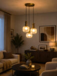 3-Light Ribbed Clear Glass adjustable pendant ceiling light with three 6-inch textured clear ribbed glass shades, decorative golden metal holders, black adjustable hanging cords, 9-inch circular canopy, and up to 23-inch adjustable height.