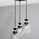 Modern Triple Glass cluster hanging light with three clear ribbed glass shades and black metal ceiling mount.