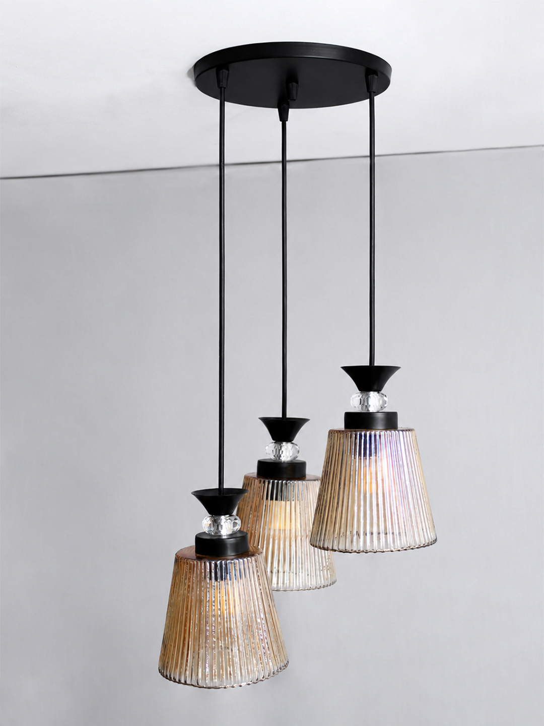3-Light Ribbed Glass Cluster Hanging Light 3-Light Ribbed Glass cluster hanging light with three clear ribbed shades, adjustable 23-inch height and black ceiling canopy.