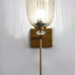 Brass finish wall light with ribbed glass shade, crystal accent and rectangular wall plate shown with product dimensions.