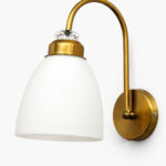 Antique brass frosted glass wall light with curved arm and white shade, 11-inch decorative wall lamp for bedroom and living room.