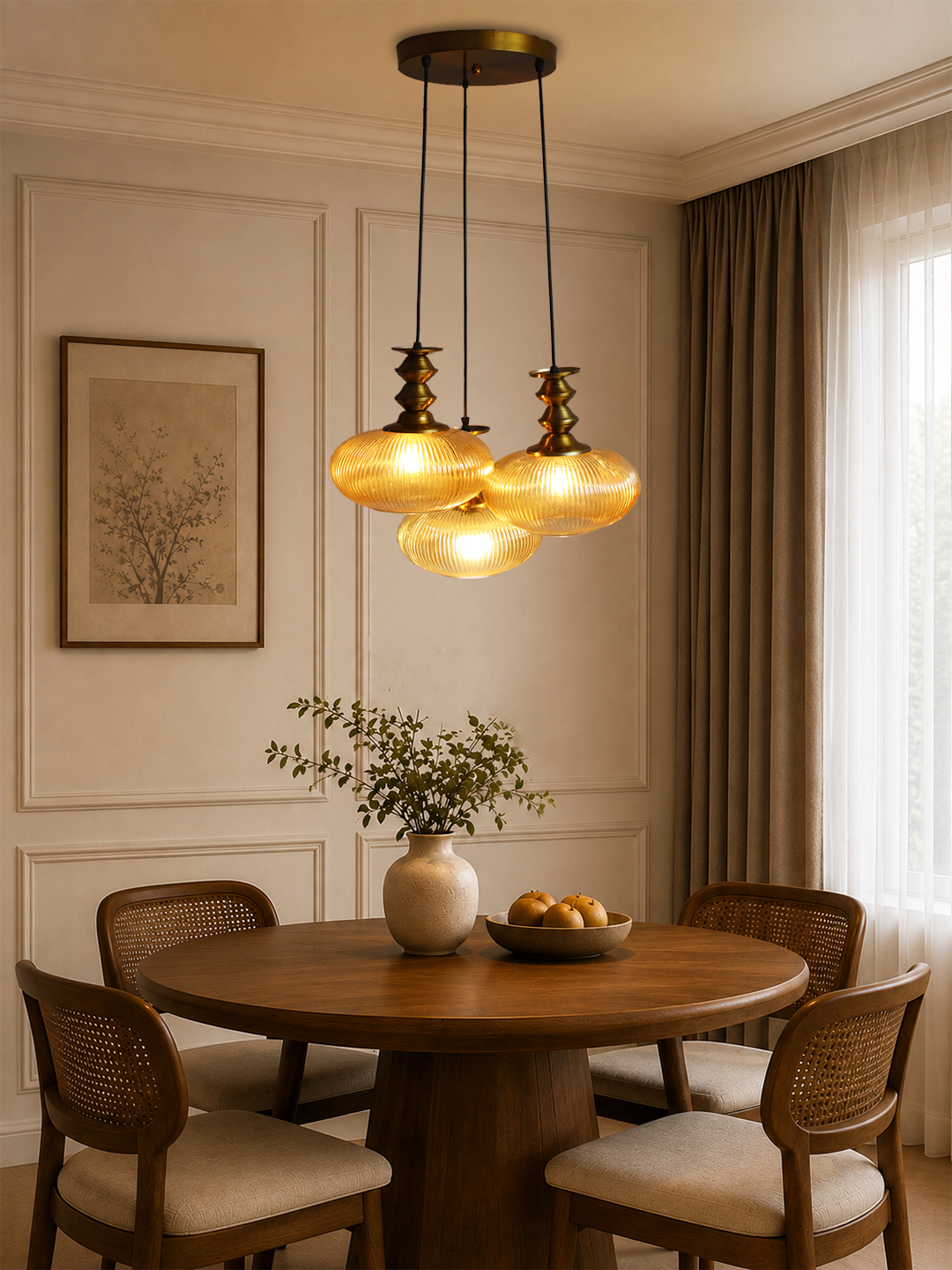 Ribbed Amber Kachori Glass Cluster Hanging Light Ribbed Amber Kachori Glass 3-light adjustable pendant ceiling light with three rounded textured amber ribbed glass shades, elegant golden metal holders, 9-inch ceiling canopy, and 23-inch adjustable hanging cords.