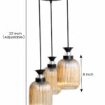 Decorative 3-Light cluster hanging light with three amber ribbed glass shades and black adjustable ceiling mount.