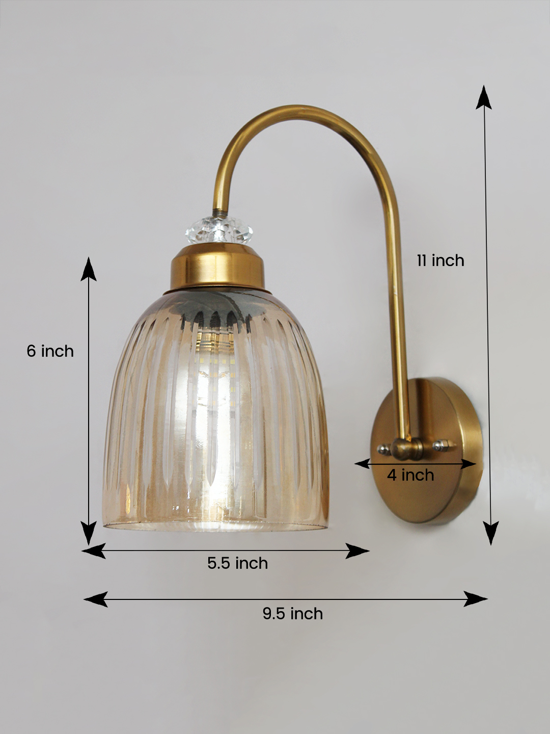 Antique Brass Amber Ribbed Glass Wall Light Antique brass wall light with amber ribbed glass shade and curved metal arm, shown with product dimensions.