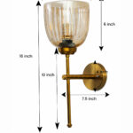 Antique brass wall light with amber ribbed glass shade and curved arm, shown with product dimensions.