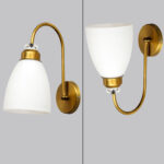 Antique brass frosted glass wall light with curved arm and white shade, 11-inch decorative wall lamp for bedroom and living room.