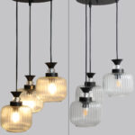 Clear Ribbed Glass cluster hanging light with three pendant shades, black metal fittings, and adjustable drops for modern dining room and living room interiors.