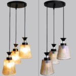 3-Light Ribbed Glass cluster hanging light with three clear ribbed shades, adjustable 23-inch height and black ceiling canopy.