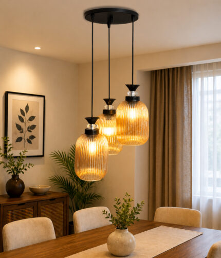 Decorative 3-Light cluster hanging light with three amber ribbed glass shades and black adjustable ceiling mount.