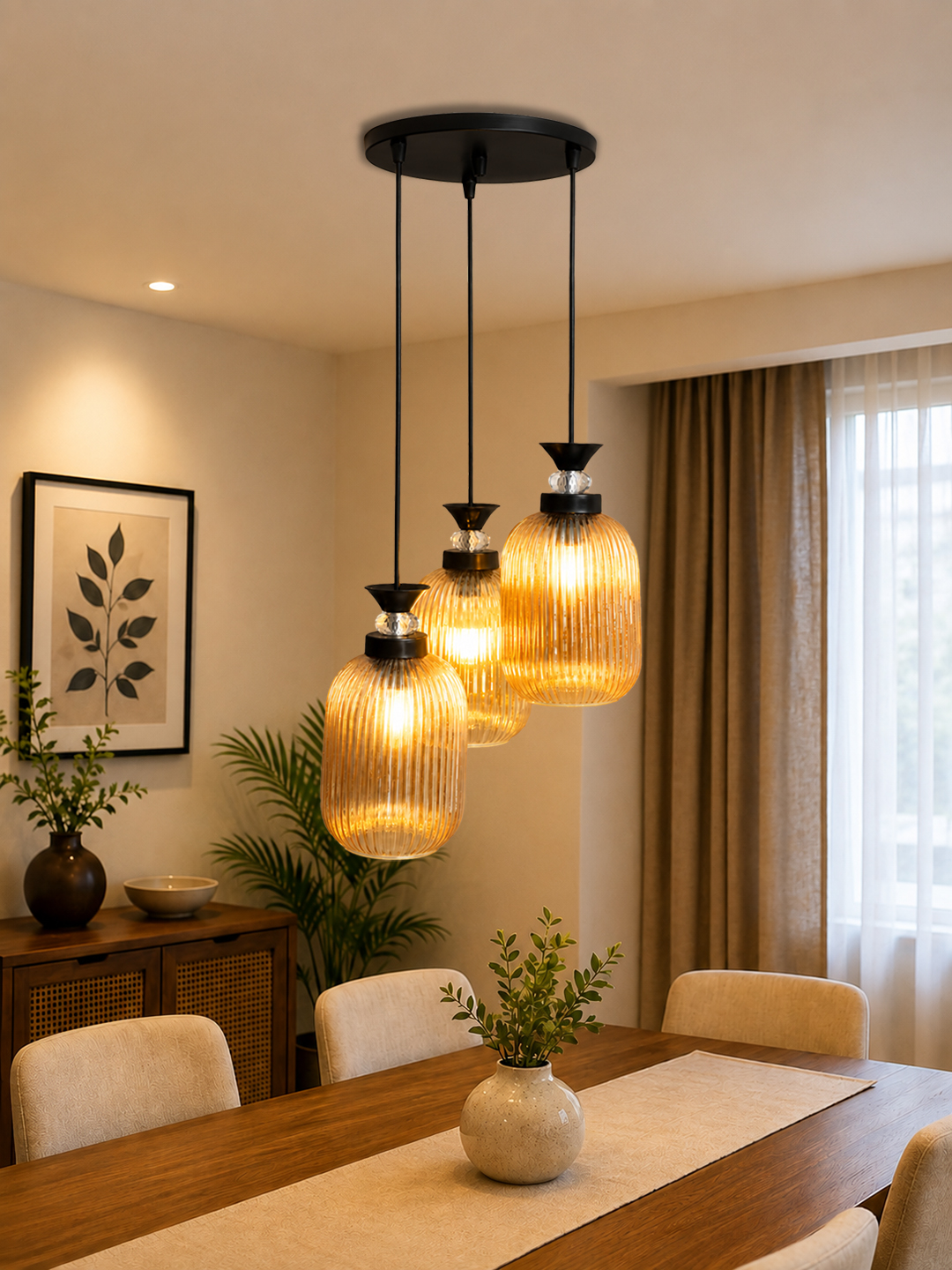 Decorative 3-Light Cluster Hanging Light Decorative 3-Light cluster hanging light with three amber ribbed glass shades and black adjustable ceiling mount.