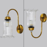Antique brass fluted glass wall light with curved arm and decorative textured glass shade