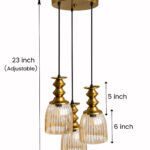 Ribbed Glass 3-Light adjustable pendant ceiling light with three textured glass shades, golden metal accents, black adjustable cords, 9-inch canopy, and elegant modern hanging design.