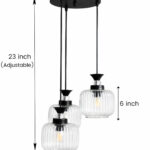 Clear Ribbed Glass cluster hanging light with three pendant shades, black metal fittings, and adjustable drops for modern dining room and living room interiors.