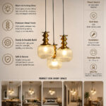 3-Light Ribbed Clear Glass adjustable pendant ceiling light with three 6-inch textured clear ribbed glass shades, decorative golden metal holders, black adjustable hanging cords, 9-inch circular canopy, and up to 23-inch adjustable height.