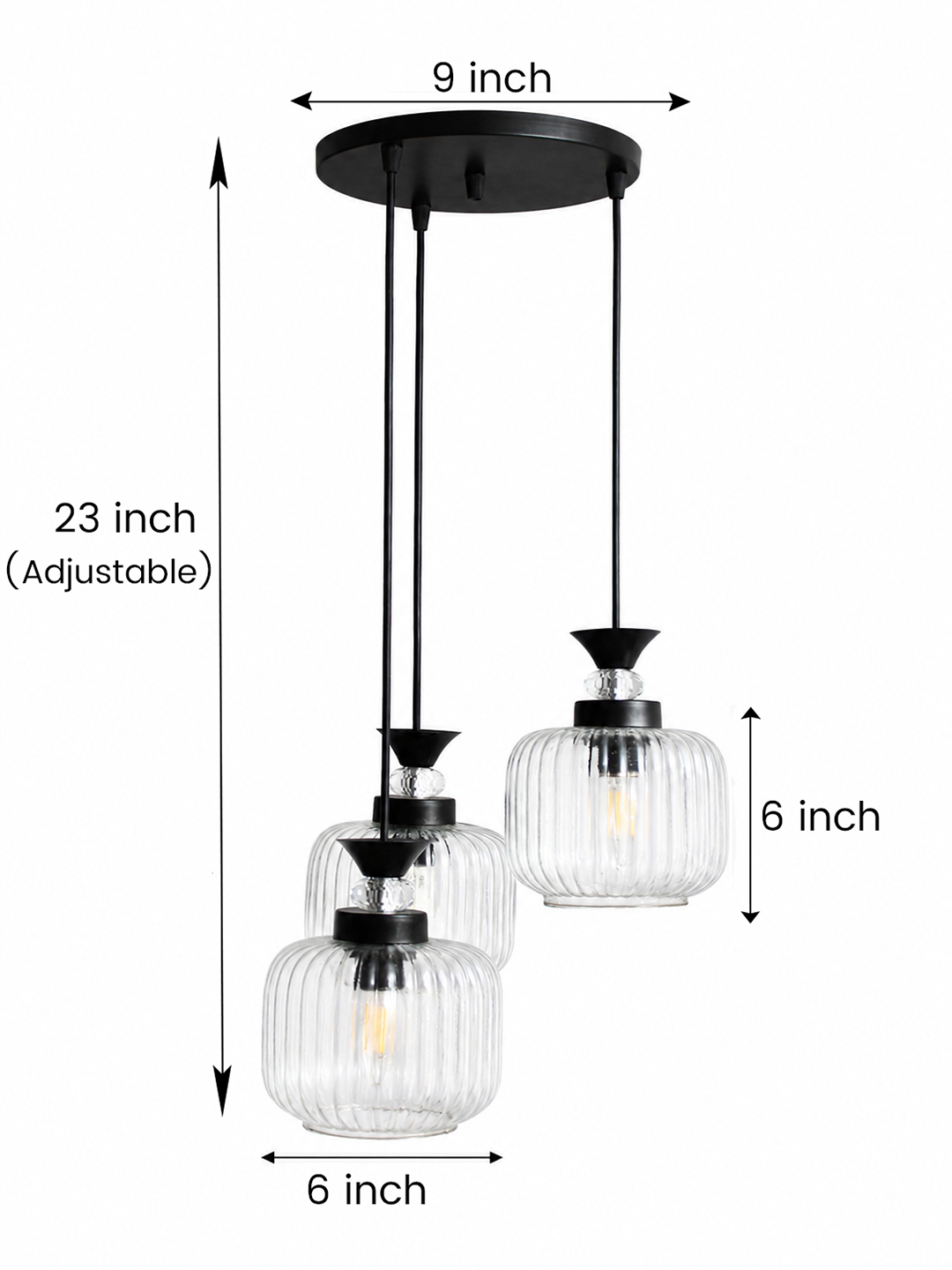 3-Light Clear Ribbed Glass Cluster Hanging Light Clear Ribbed Glass cluster hanging light with three pendant shades, black metal fittings, and adjustable drops for modern dining room and living room interiors.