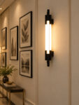 Black vertical LED wall light with multiple white diffusers and slim modern design