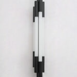 Black vertical LED wall light with multiple white diffusers and slim modern design