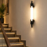 Black vertical LED wall light with multiple white diffusers and slim modern design