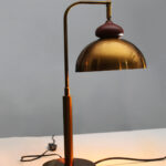 Gold Brass Table Lamp with vintage dome shade, curved brass arm, and round base, 15 inches tall with an 8-inch shade.
