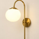 Gold finish wall light with Round White Glass globe and curved arm for modern home decor
