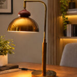 Gold Brass Table Lamp with vintage dome shade, curved brass arm, and round base, 15 inches tall with an 8-inch shade.