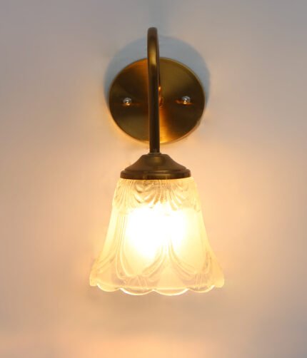 Flower Glass Wall Lamp with antique brass finish and decorative clear floral glass shade.