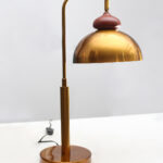 Gold Brass Table Lamp with vintage dome shade, curved brass arm, and round base, 15 inches tall with an 8-inch shade.
