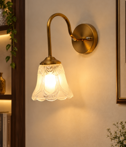 Flower Glass Wall Lamp with antique brass finish and decorative clear floral glass shade.
