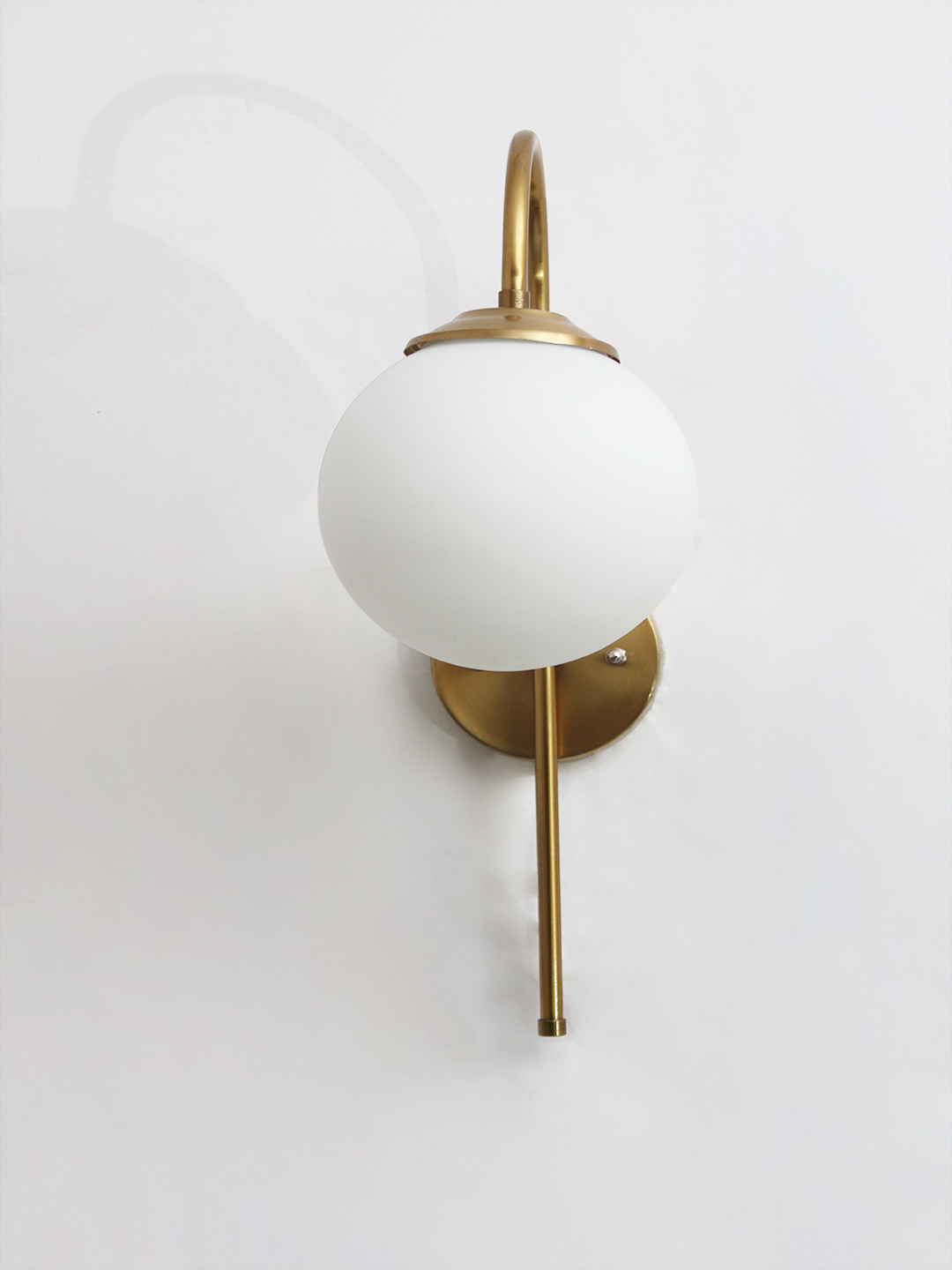 Wall Light Gold Finish with Globe Milky White Glass Gold finish wall light with Round White Glass globe and curved arm for modern home decor